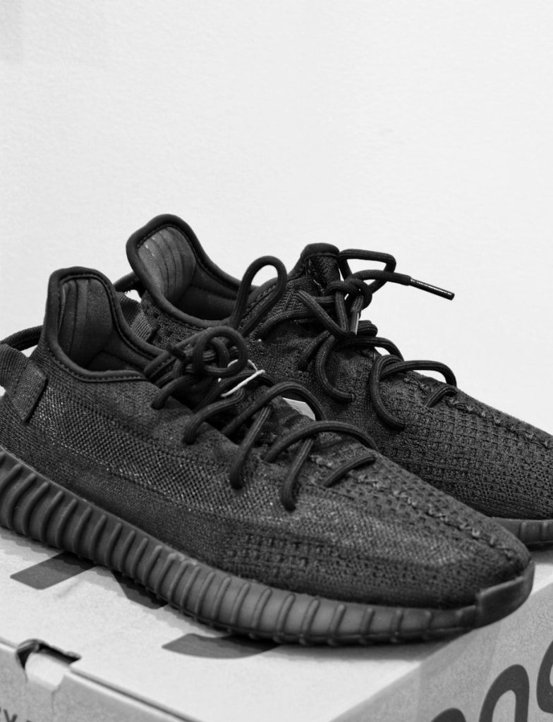 A black and white photo of a shoe on a box